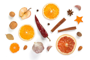 dried fruit and spices on white background
