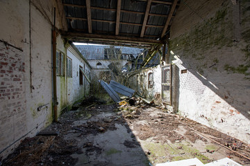 Fototapeta na wymiar Farmyard on abandoned farm in Jutland on abandoned farm in Jutland