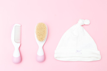 Childcare for baby girl on a pink background. Flat lay