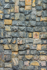 Natural rock fence. The exterior decoration of many building.