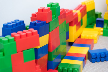 Obraz premium The colored bricks of the designer are lying on the floor