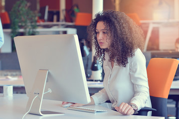 Woman working at computer in an office