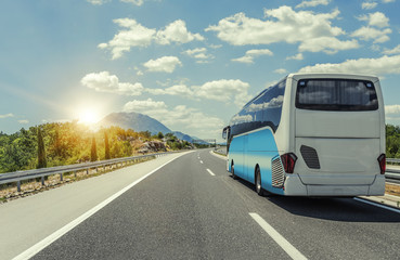 Bus rushes along the asphalt high-speed highway.