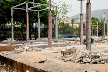 Demolition of a building with concrete floors and pillars, old house