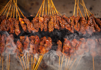 Balinese Indonesian street food pork sate babi in smoke