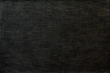 Linen homespun fabric in black color. Background.