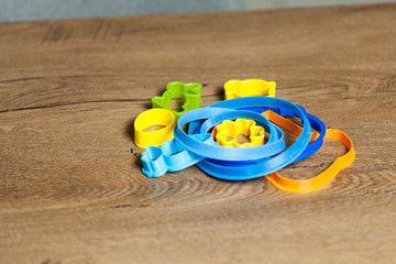 close up of female hands making cookies from fresh dough at home