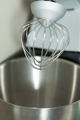 Top of modern mixer with steel whisk