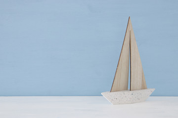 nautical concept with sail boat over blue background.
