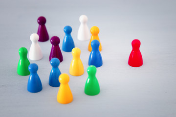 image of colorful game figures over wooden table ,human resources and management concept.