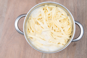fresh pasta in the pan of water just after cooking