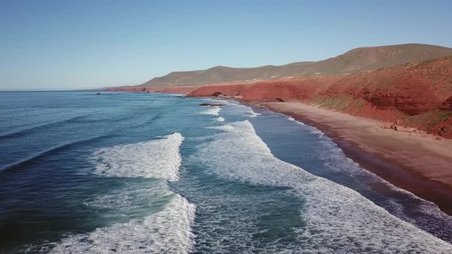 Aerial view on Legzira beach with arched rocks on the Atlantic coast in Morocco, 4k