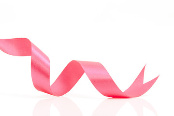 Pink curly ribbon on white