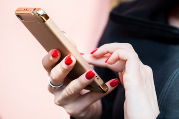 Female hands texting on smartphone