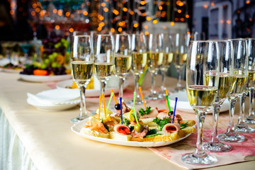 Line of glasses with champagne at the furshet