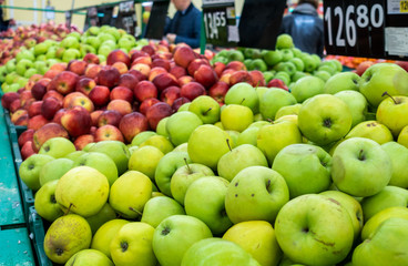 green and red apples on the farm market