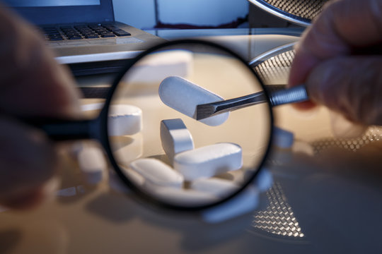 Tablets and a magnifying glass