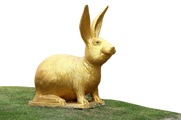 Golden Rabbit Figurine on green Grass