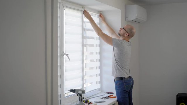 Full-lenght shot of an adult man renovating his house.