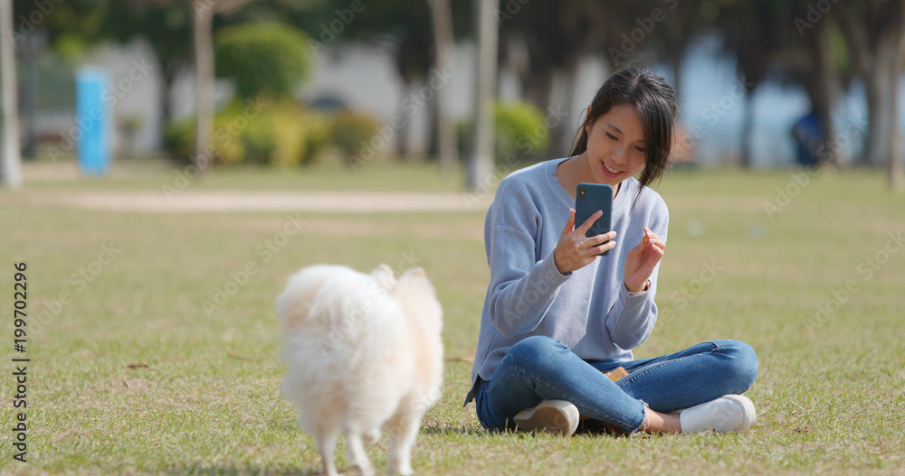 Sticker Woman taking photo on her dog with cellphone