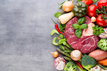 Raw fresh meat Ribeye Steak with vegetables and spice.