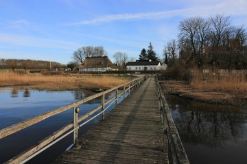 Obraz premium view to the pier of the historic village of Sieseby