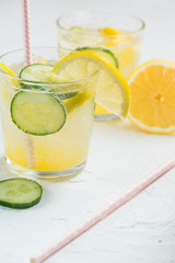 Sassy detox water with lemons, cucumbers and ginger. Healthy breakfast.