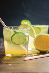 Sassy detox water with lemons, cucumbers and ginger. Healthy breakfast.