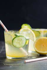 Sassy detox water with lemons, cucumbers and ginger. Healthy breakfast.