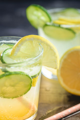 Sassy detox water with lemons, cucumbers and ginger. Healthy breakfast.