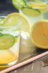 Sassy detox water with lemons, cucumbers and ginger. Healthy breakfast.