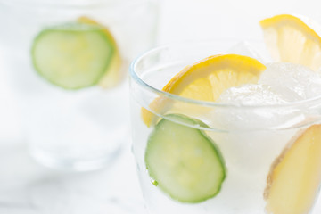 Sassy detox water with lemons, cucumbers and ginger. Healthy breakfast.