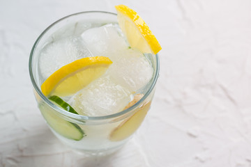 Sassy detox water with lemons, cucumbers and ginger. Healthy breakfast.