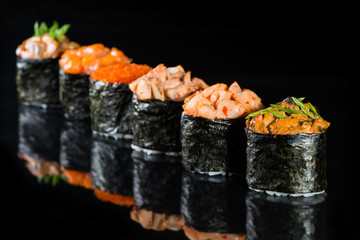 Gunkan sushi on a dark background
