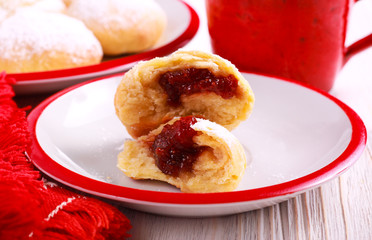 Jam filling doughnuts coated with icing sugar