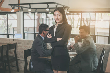 Fototapeta premium Portrait of a business woman and colleagues background