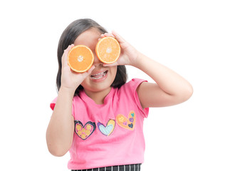 cute asian girl playing with fresh mandarin fruits isolated