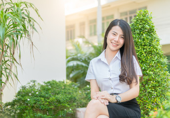 asian woman in uniform student smile in garden,