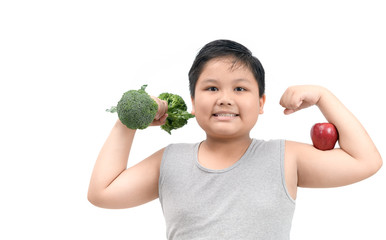 Obese fat boy holding a broccoli dumbbell
