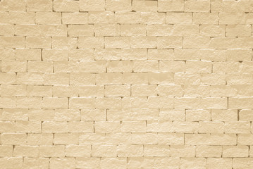 Brick wall pattern texture background painted in light yellow beige color