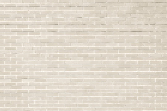 Fototapeta Brick wall texture pattern background in natural light cream beige brown color
