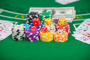 Poker chips and banknotes on table in casino
