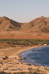 Fototapeta na wymiar deserted beach in an arid environment with volcanic mountains. Genoveses, almeria, Andalusia, Spain