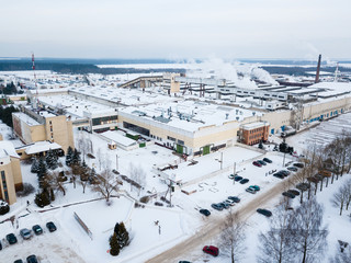 Aerial shot. Big factory on a winter day