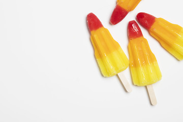 Rocket shaped ice lolly on a white background.