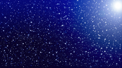 Fototapeta na wymiar falling snow on background of blue sky