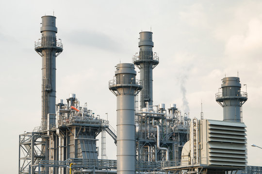 Oil and gas industrial,Oil refinery plant form industry,Refinery factory oil storage tank and pipeline steel with sunset and cloudy sky background,Thailand