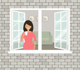 A young woman in red dress is drinking coffee by the open window. View of the room from the street side. There is a sofa and paintings on the wall in the living room. Vector illustration