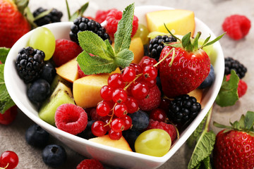 salad with fresh fruits and berries. healthy spring fruit salad