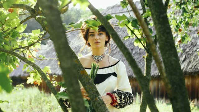 Cinemagraph - Ukrainian girl in sunrays posing on camera .